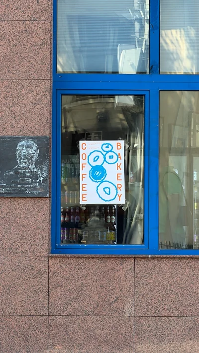 Coffee Bakery Sign in Blue-Framed Window