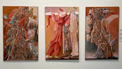 Three large surrealist paintings displayed in an art gallery