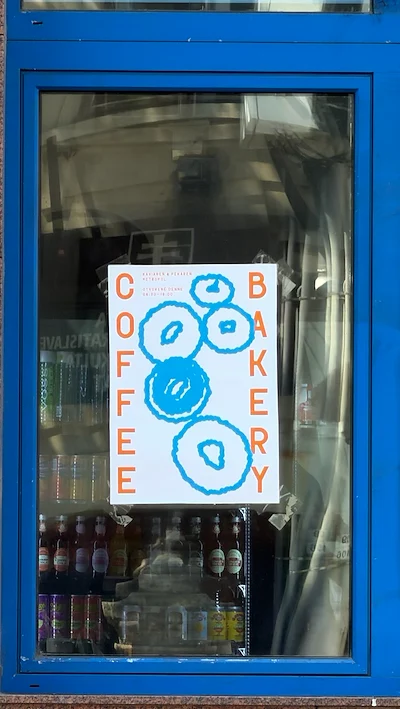 Coffee Bakery Poster in Blue-Framed Shop Window